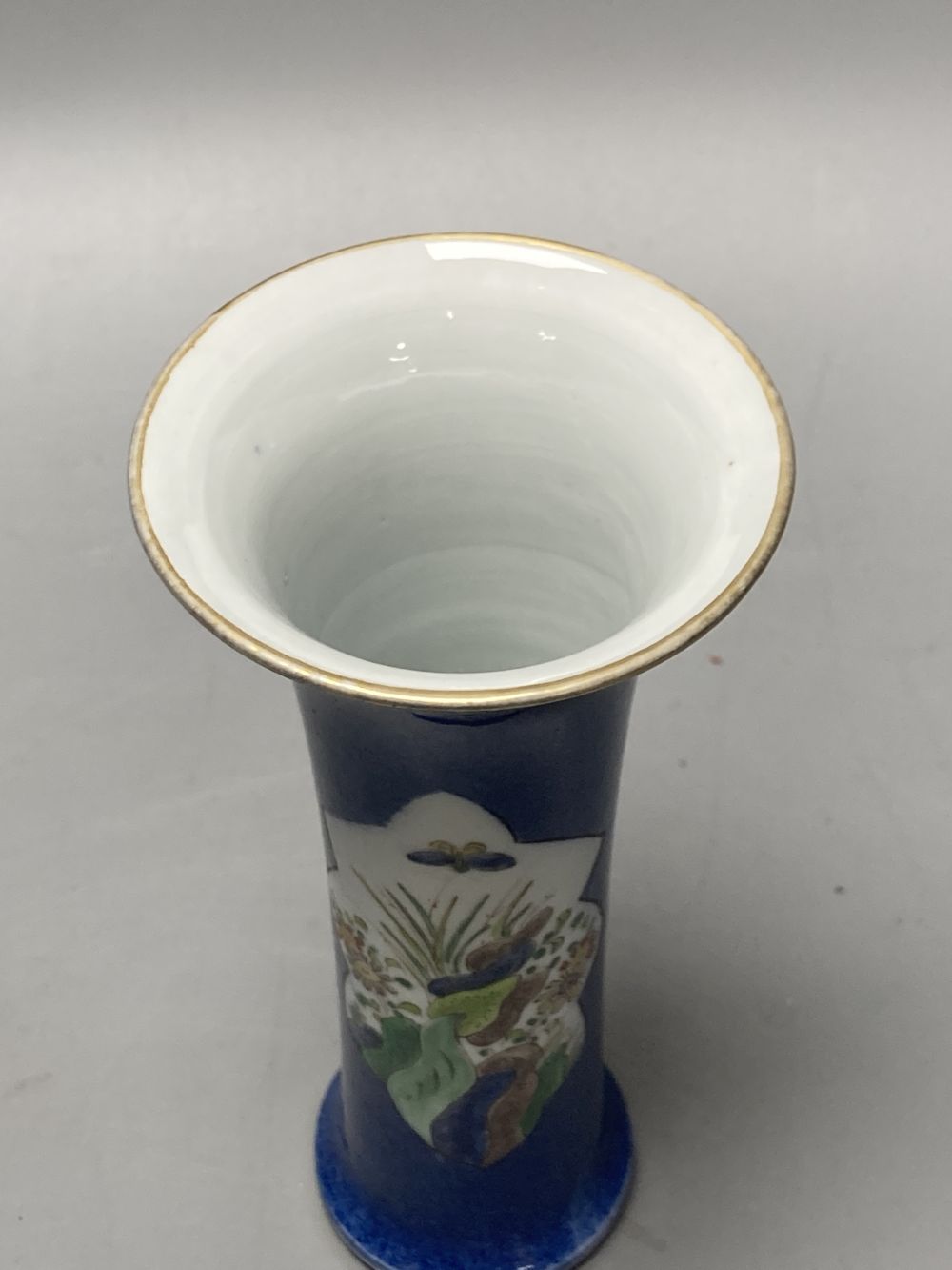 A Chinese powder blue ground vase and a similar cloisonne bottle vase, height 15cm